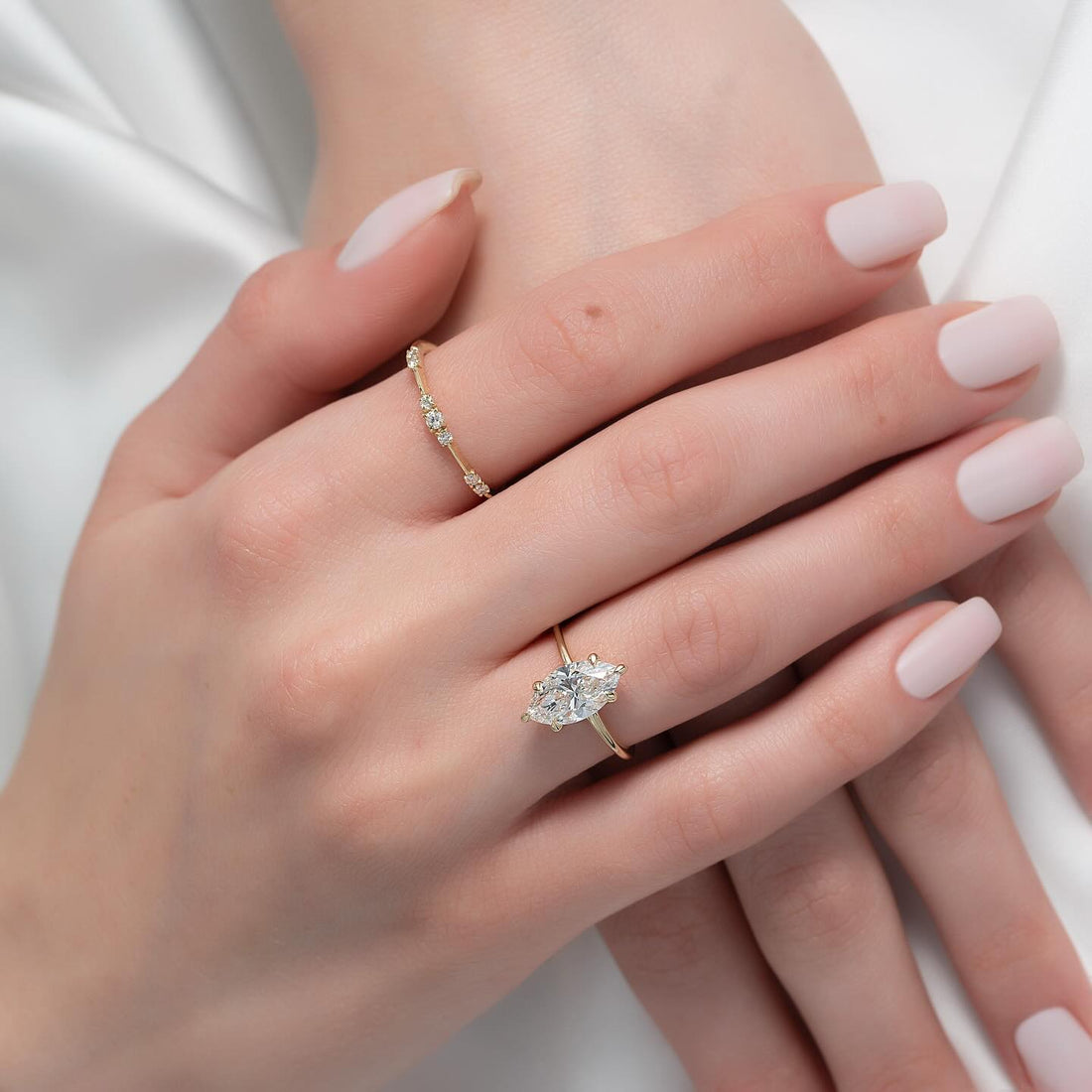 Marquise cut lab grown diamond solitaire in yellow gold worn on the hand