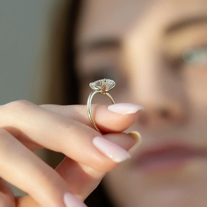 Low profile claw setting on the east west marquise diamond ring