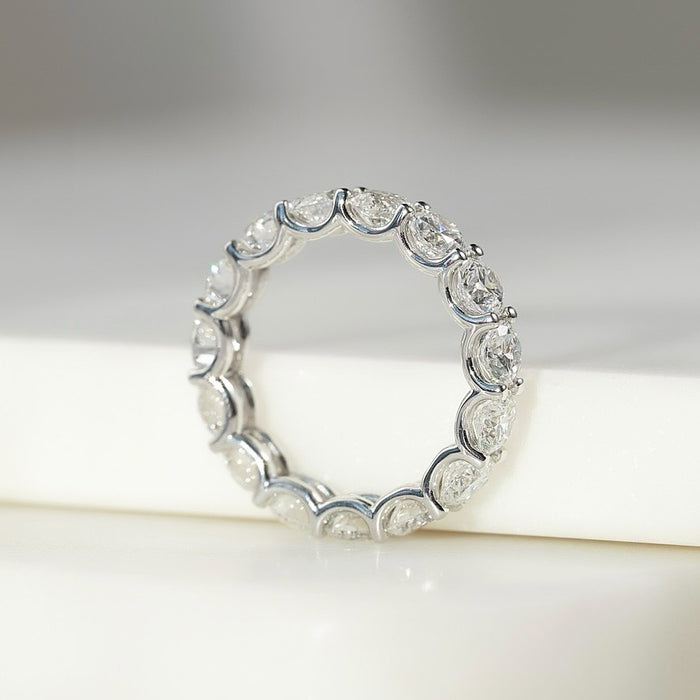 Round moissanite full eternity band ring profile in white gold