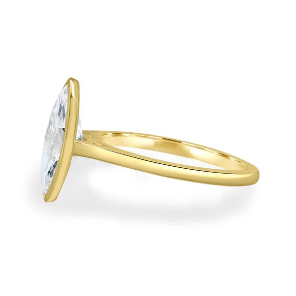 Marquise cut lab grown diamond full bezel ring on a fine cathedral band