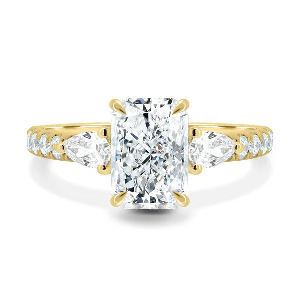 Radiant cut lab grown diamond three stone ring with pear sides and pave