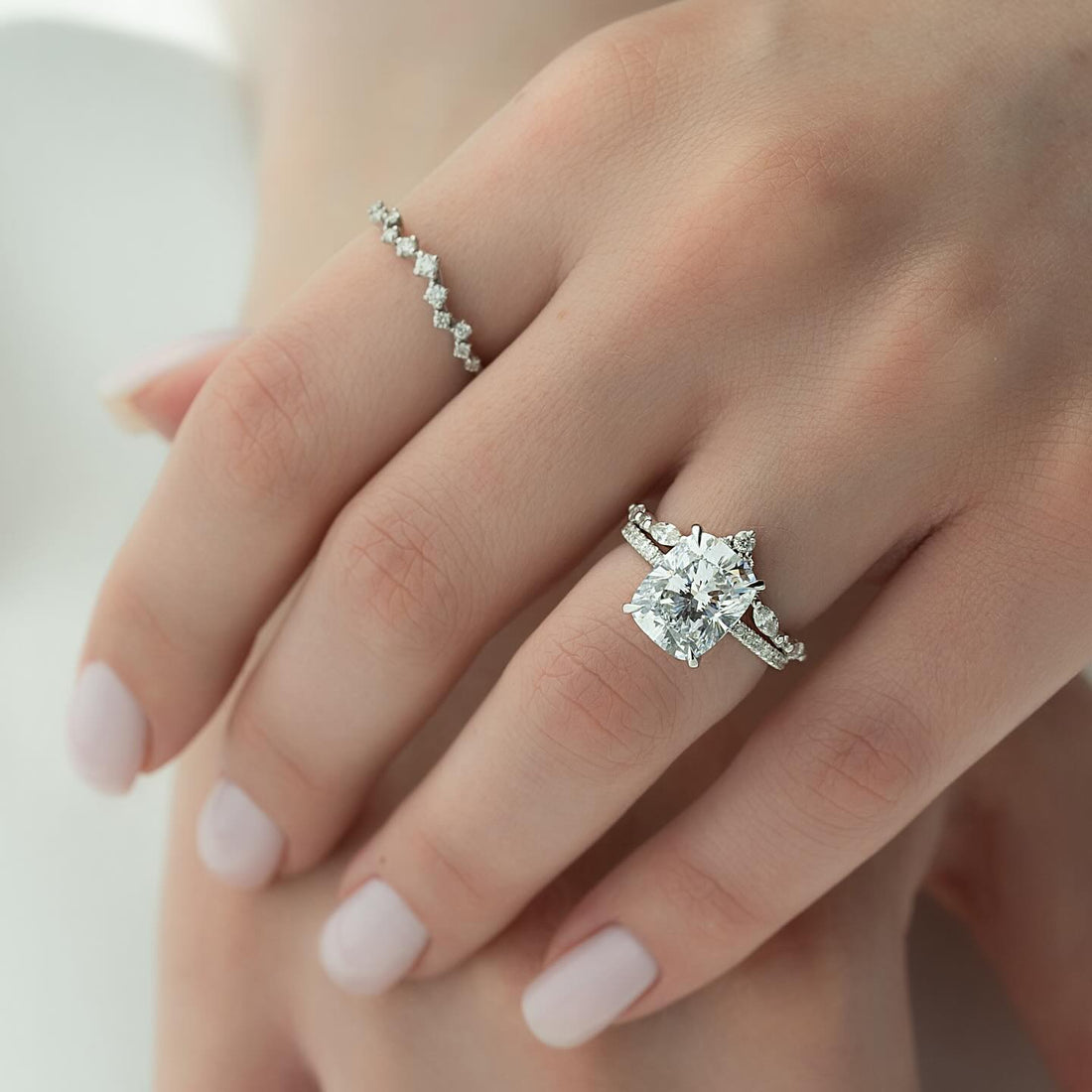 Cushion cut lab grown diamond ring in white gold with six claws and marquise accents