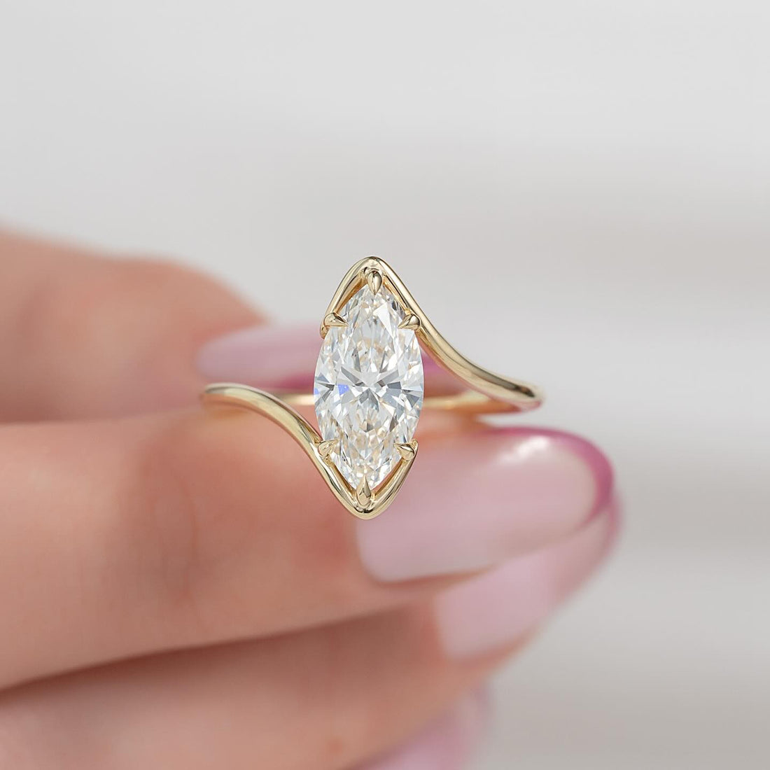 Marquise cut lab grown diamond bypass solitaire ring in yellow gold, front view