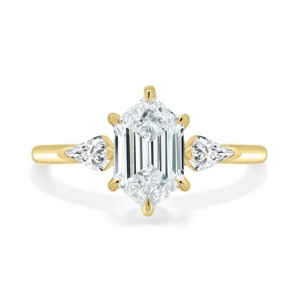 Elongated hexagon cut lab grown diamond trilogy ring with kite side stones