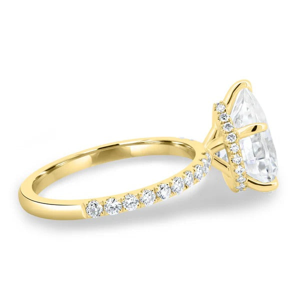 Pear shaped hidden halo visible in side profile of diamond ring
