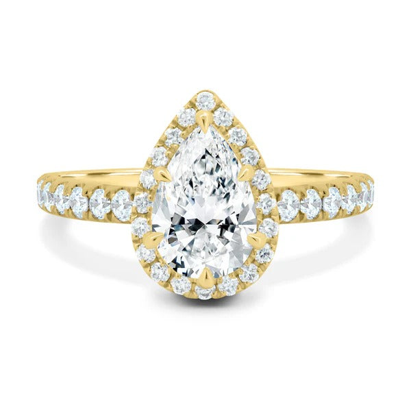 Pear cut lab grown diamond halo ring with pave shoulders