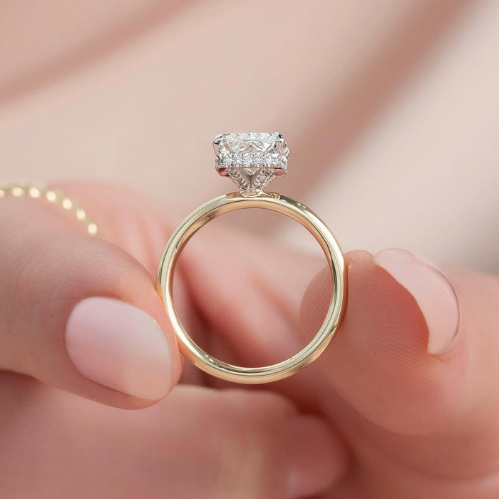 Four claws gripping the cropped corners of the elongated radiant diamond
