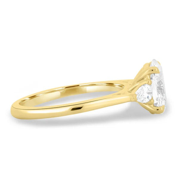 Oval lab grown diamond trilogy ring with pear sides detail view
