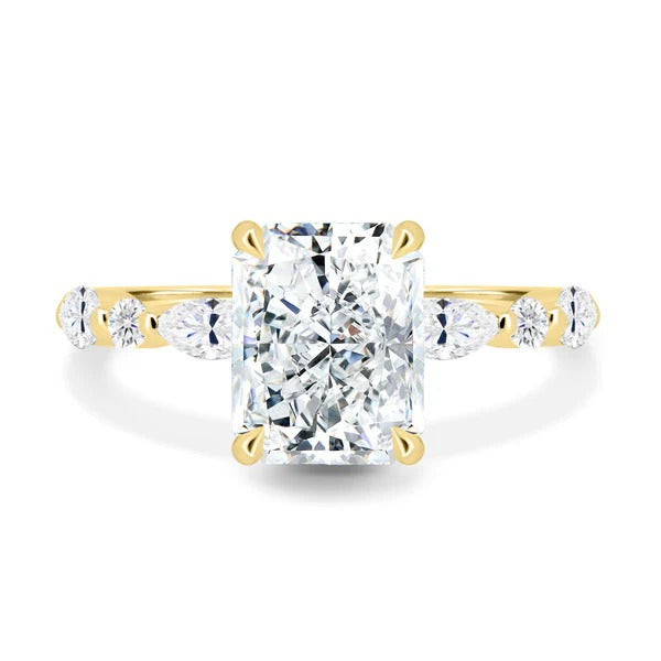 Radiant cut lab grown diamond ring with marquise and round accent band