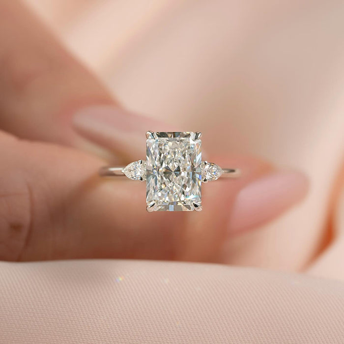 Pear accent diamonds at diagonally opposite corners of the radiant