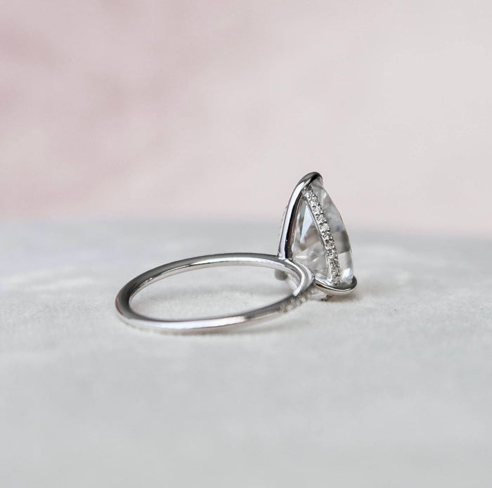 Pear cut lab grown diamond avant garde anniversary ring, angled view