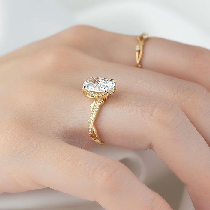 Oval cut lab grown diamond ring in yellow gold on a spiralling pave vine shank