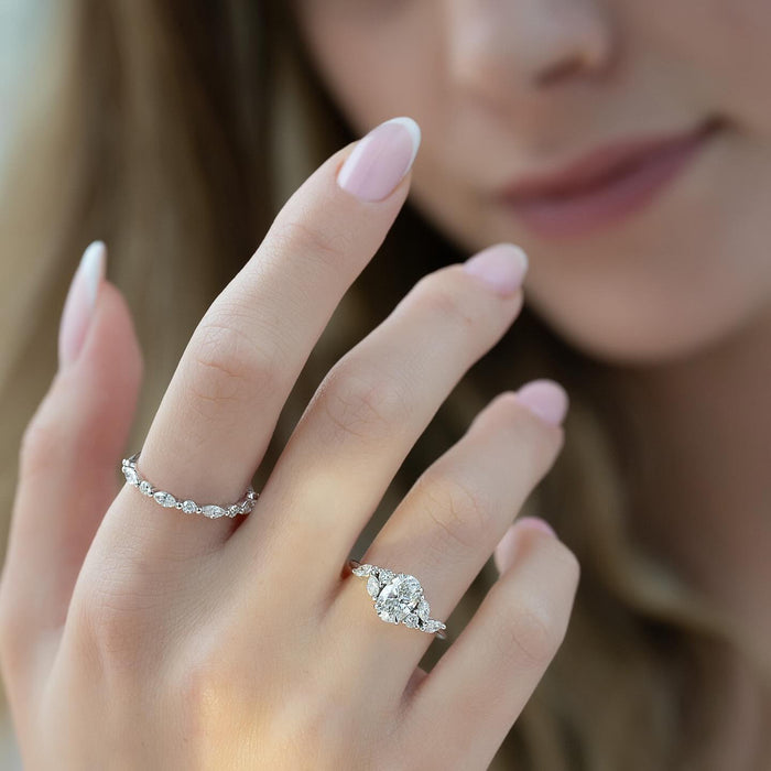 Oval cut lab grown diamond ring in white gold with paired marquise and pear shoulder accents