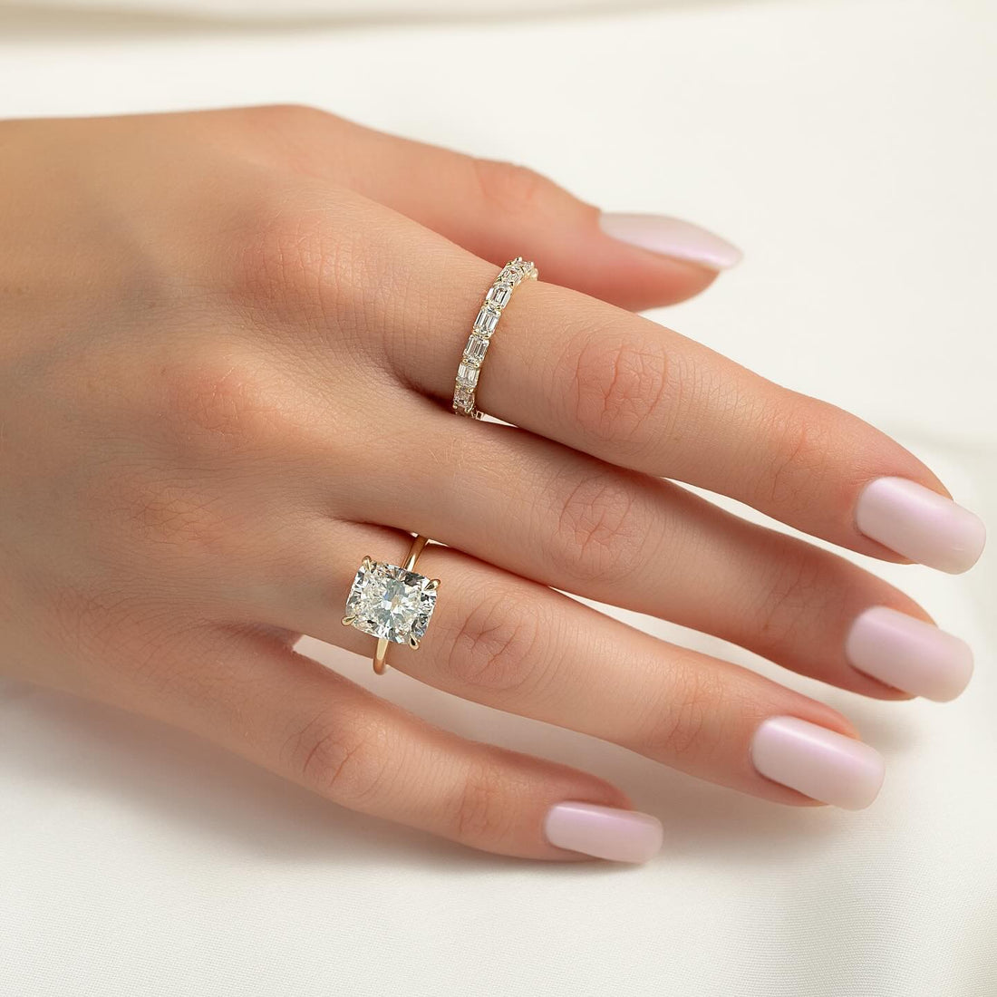 Cushion cut lab grown diamond solitaire ring on a fine plain yellow gold band