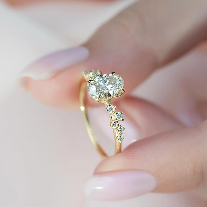 Close view of the scattered accent placement beside the oval lab grown diamond