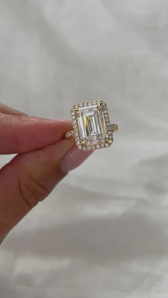 Emerald cut lab grown diamond halo ring with pave band