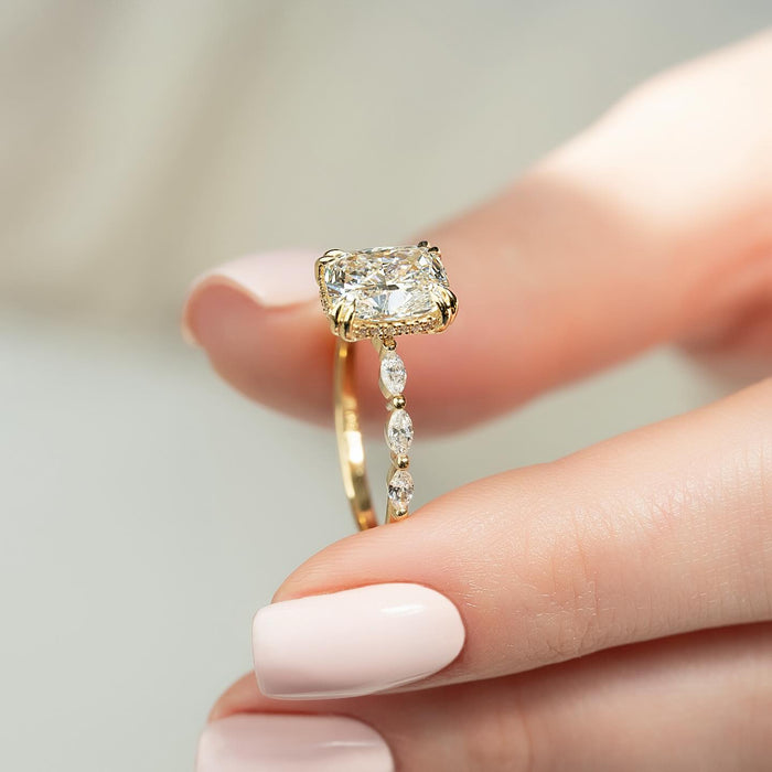 Elongated cushion lab grown diamond ring showing the concealed halo and marquise accents