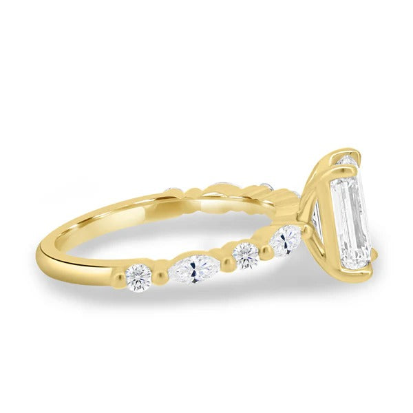 Side view showing spaced marquise and round accents on a fine shank