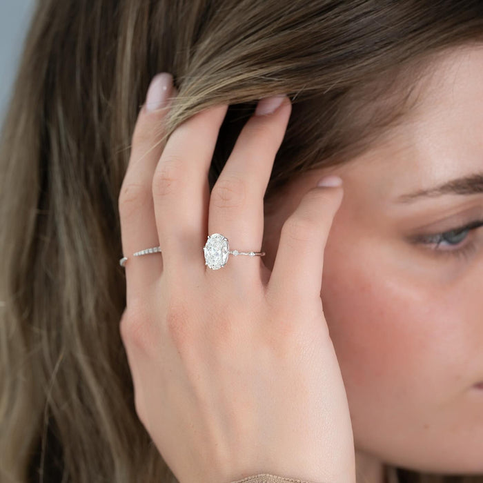 Elongated cushion lab grown diamond ring in white gold worn on the hand