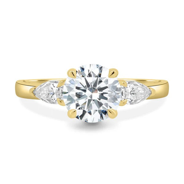 Round cut lab grown diamond basket set three stone ring with pear sides