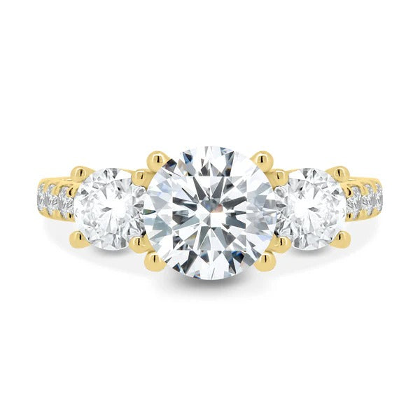 Round cut lab grown diamond three stone ring with pave shoulders