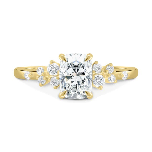 Elongated cushion cut lab grown diamond ring with scattered cluster accent shoulders