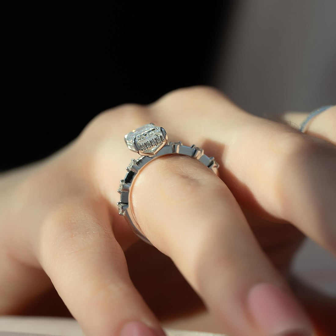 Emerald cut lab grown diamond ring with hidden halo and station set accents in white gold