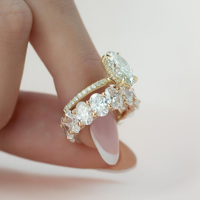 Oval lab grown diamond bridal ring set showing the hidden halo and the oval eternity band