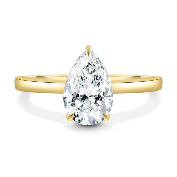 Pear cut lab grown diamond three claw solitaire ring
