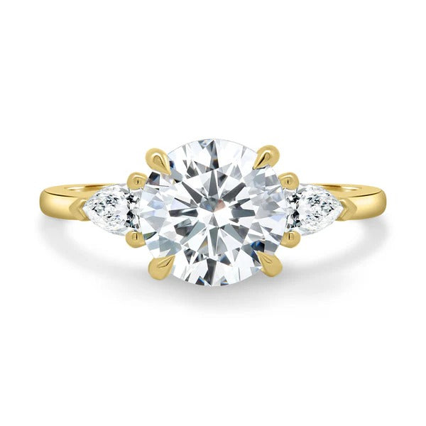 Round cut lab grown diamond three stone ring with pear side stones