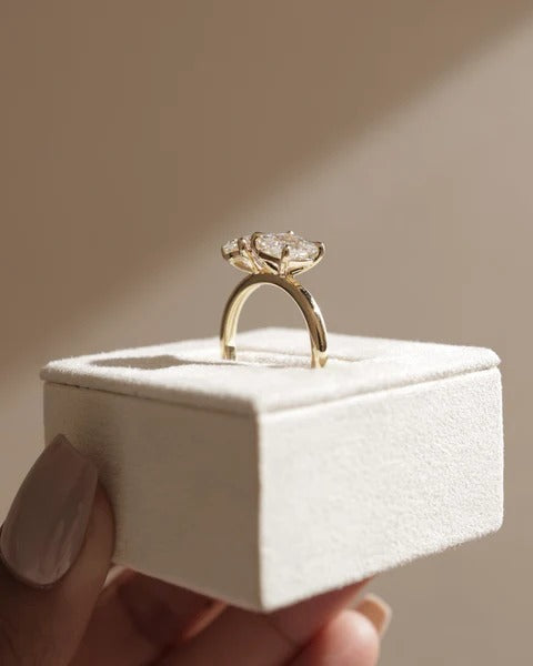 Pear and princess two stone ring shown from the side