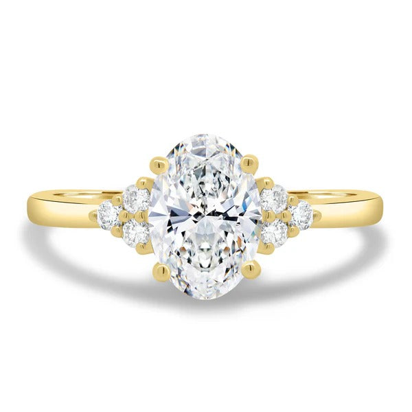 Oval cut lab grown diamond ring with triangular round cluster shoulder accents