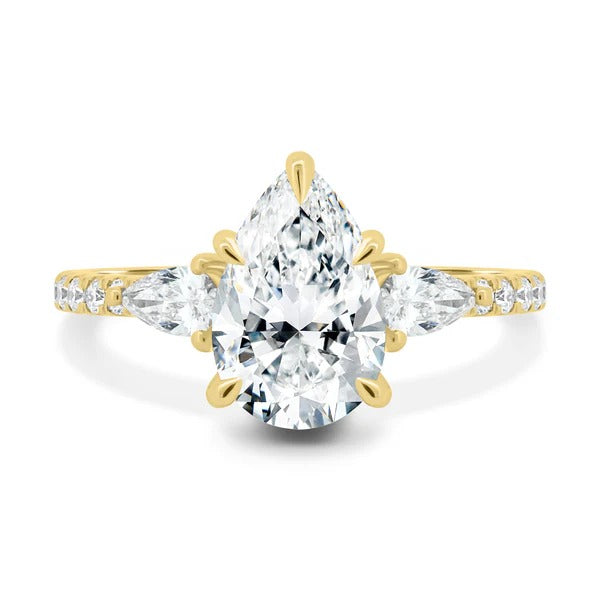 Pear trilogy three stone diamond ring detail