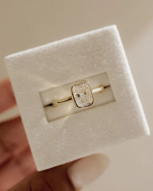 Cathedral bezel set cushion diamond ring detail