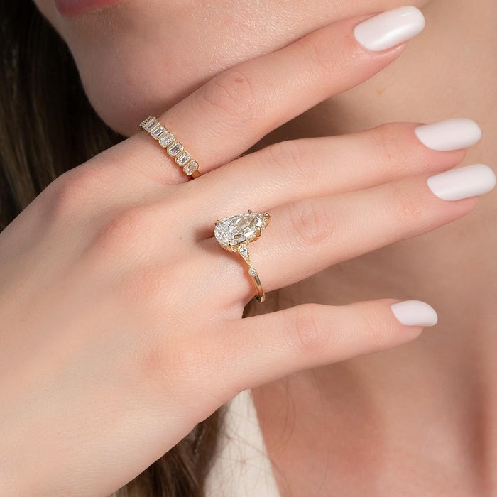 Beaded cathedral gallery beneath the pear cut diamond