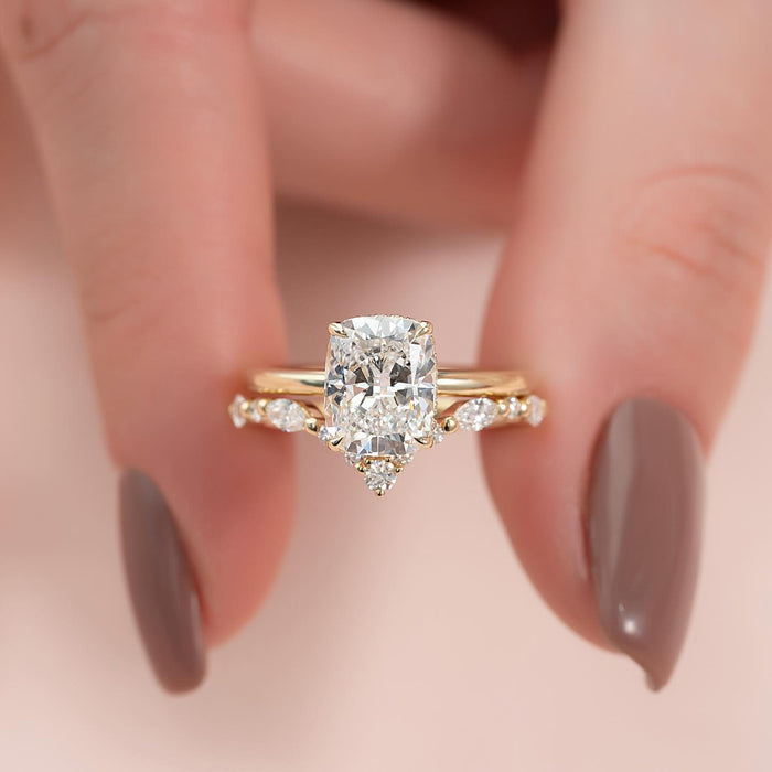 Marquise and round accent stations spaced along the slim shoulders