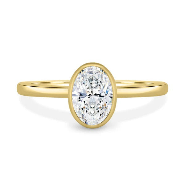 Oval cut lab grown diamond bezel set solitaire ring with slim band
