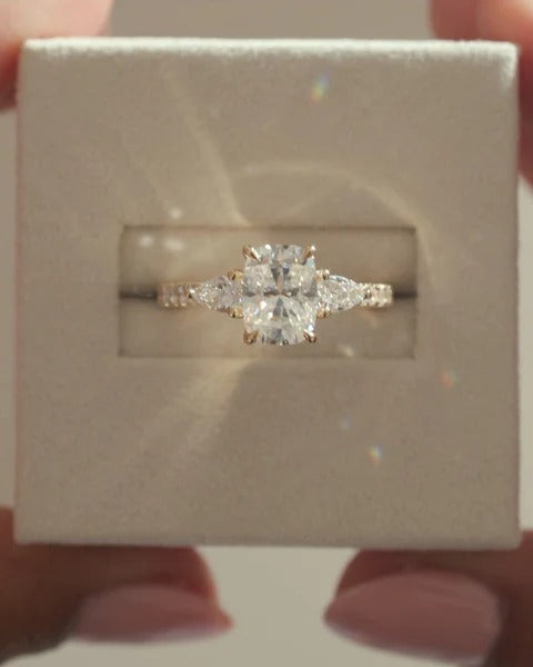 Elongated cushion cut lab grown diamond three stone ring with pave band