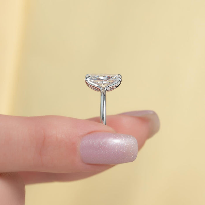 Profile of the radiant cut solitaire showing the open gallery and knife edge shank