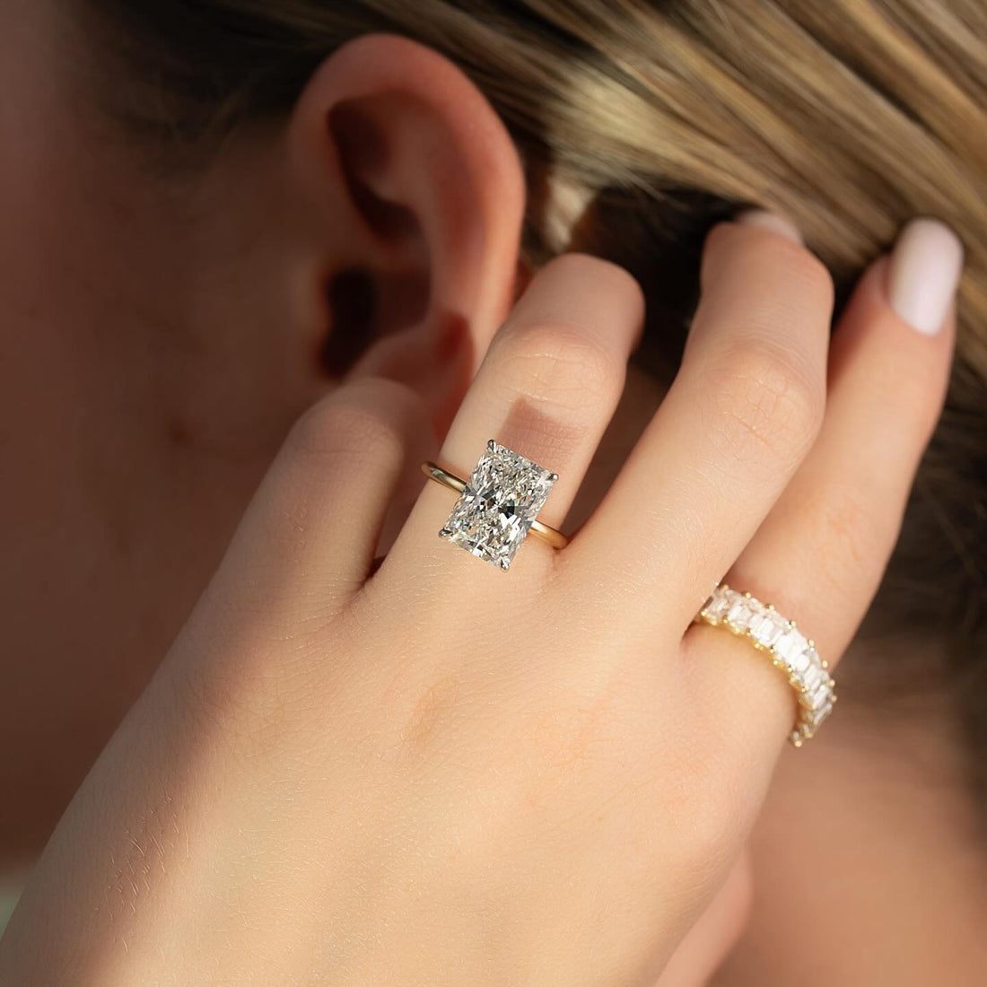 Radiant cut lab grown diamond ring with double claw corners in yellow gold