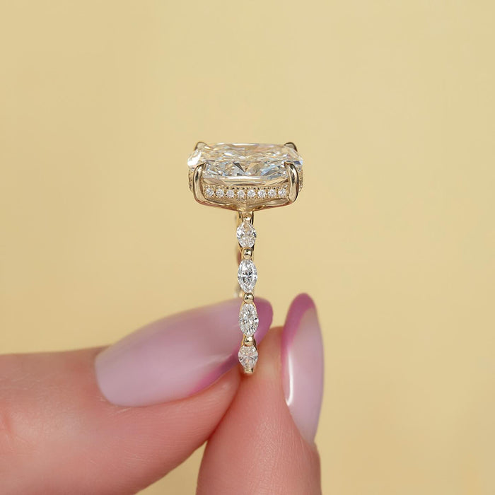 Profile showing marquise cut accent diamonds along the band and the hidden halo collar