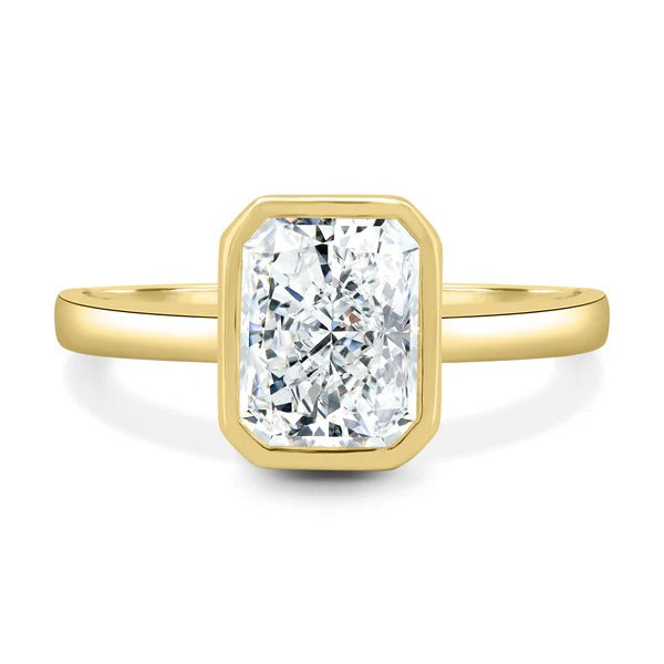 Radiant cut lab grown diamond full bezel ring on a plain polished band