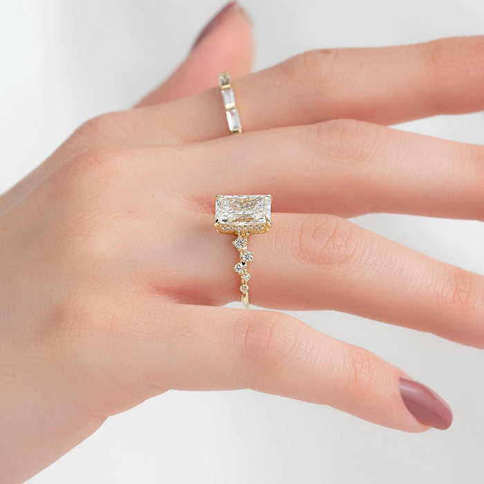 Marquise and round accent clusters beside the radiant centre diamond