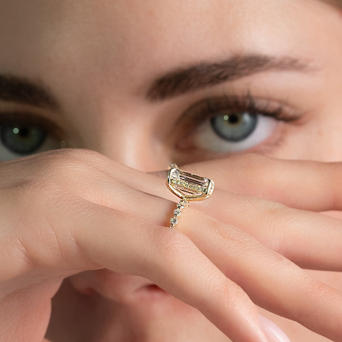 Profile showing the pave hidden halo beneath the emerald cut centre stone
