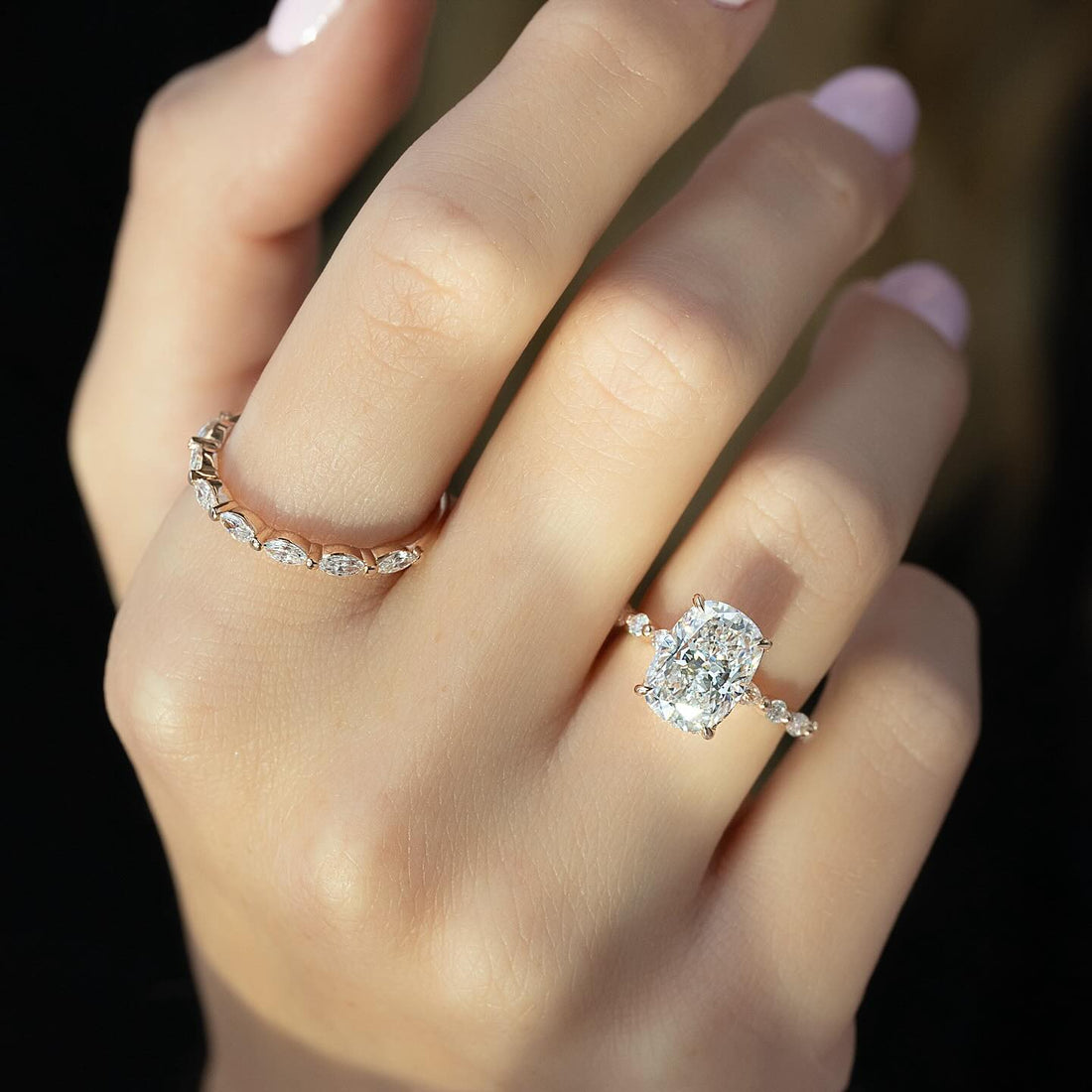 Elongated cushion lab grown diamond ring with marquise and round accent shoulders in rose gold