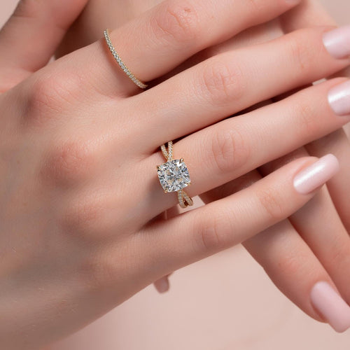 Cushion cut lab grown diamond engagement ring with twisted pave shank in yellow gold