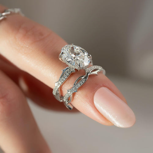 Oval cut lab grown diamond bridal ring set with sculpted vine pave bands in white gold