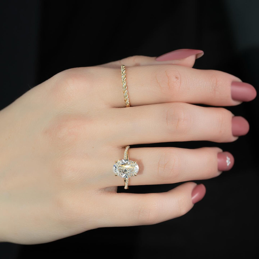 East west oval cut lab grown diamond ring with pave shoulders in yellow gold