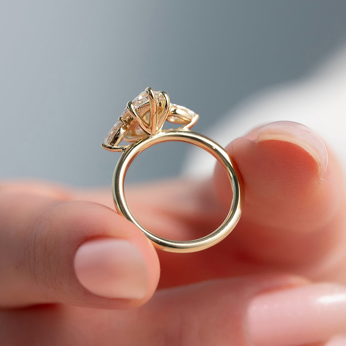 Profile of marquise and pear compass cluster lab grown diamond ring in yellow gold