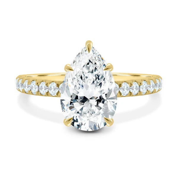 Pear cut lab grown diamond five claw solitaire ring with two thirds pave band